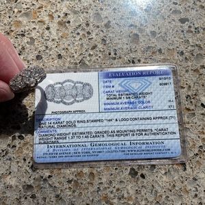 14 Karat gold ring, stamped 14k and logo; H-1 color, clarity l(1).